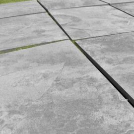 beside grey porcelain paving